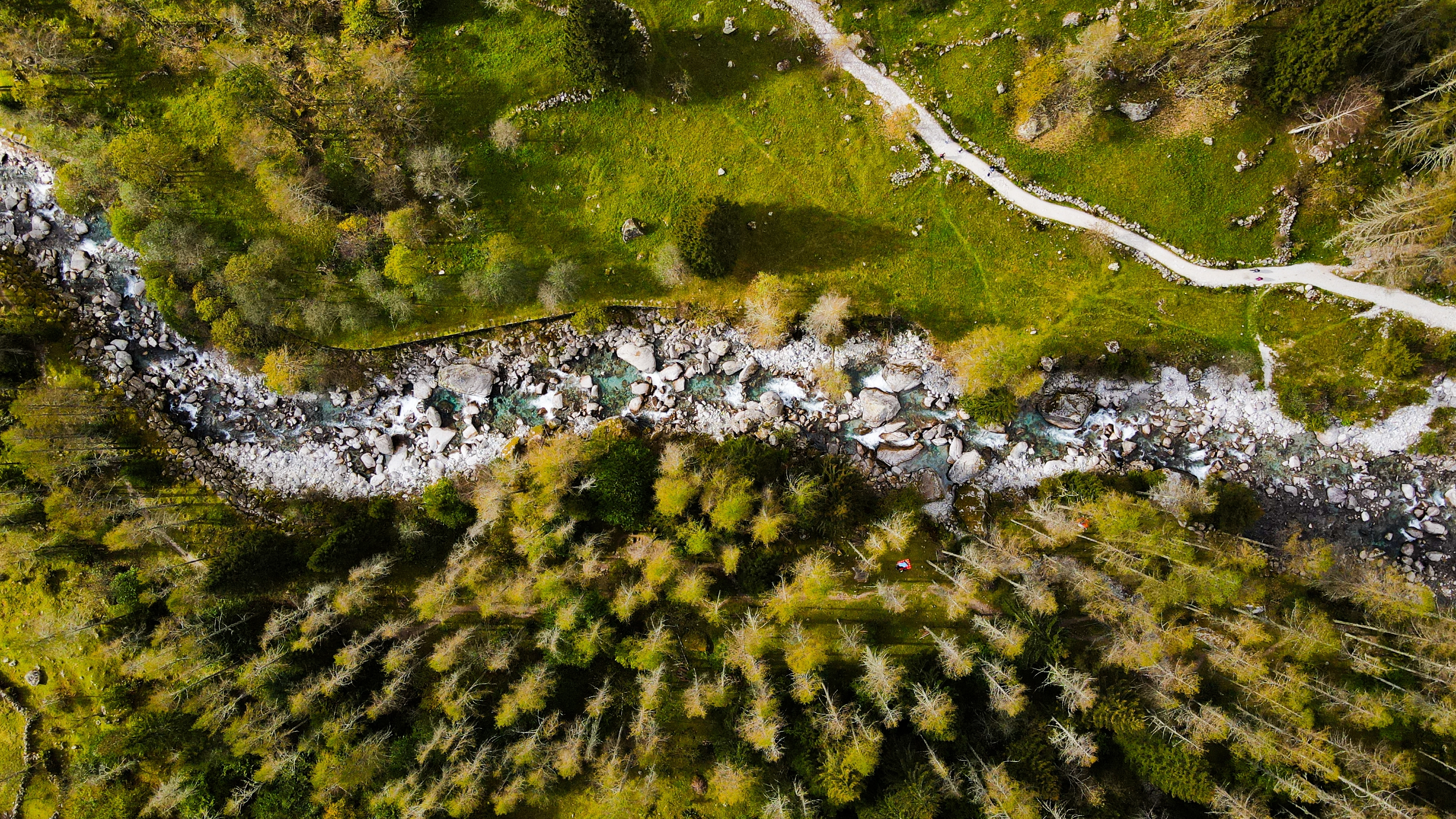 Aerial drone view of forested river valley used for pre-purchase terrain analysis